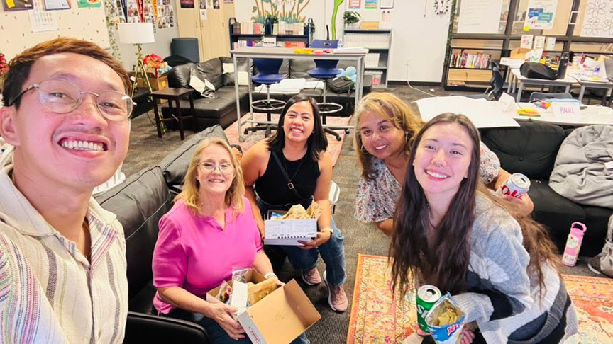 Teachers smile during a training